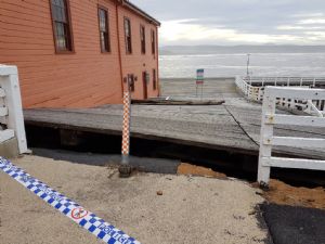 The damaged section of Tathra Wharf, on the western side of the old warehouse.