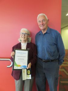 Gae Rheinberger is congratulated by her husband John on receiving her Bega Valley Shire Medallion this week.